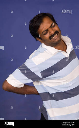 mature-indian-man-with-back-pain-B513MM