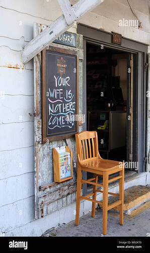 funny-sign-outside-seedy-bar-M92K70